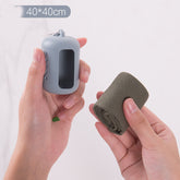 ActiveGear RO yoga towel in hands showing compact silicone bag and rolled towel, perfect for gym and travel.